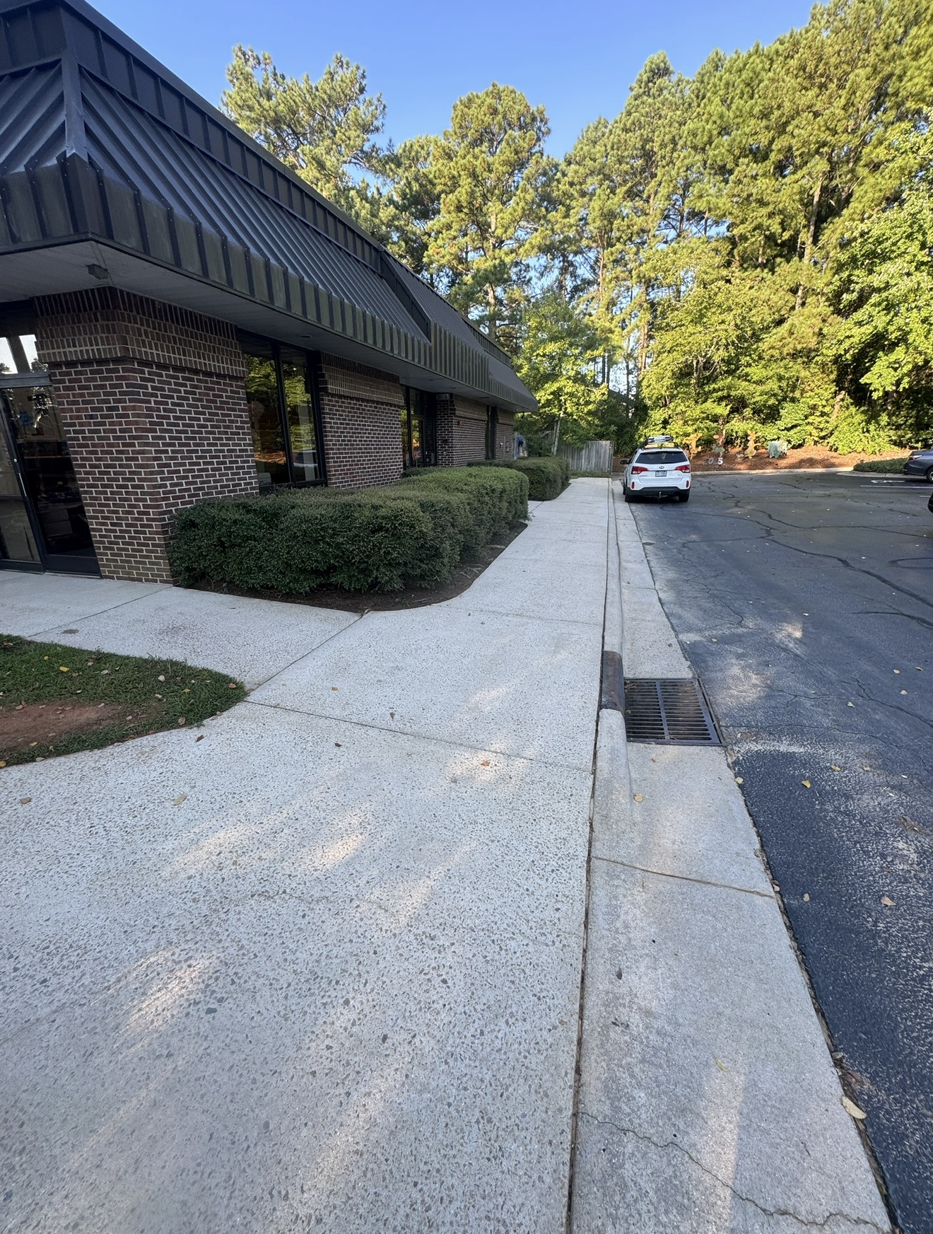 Clean commercial sidewalk after pressure washing in Wendell NC by Green Eagle Pressure Washing